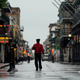 A man stands in middle of a street in the French Quarter of New Orleans ahead of the arrival of Hurricane Ida.